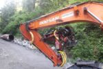 DOOSAN DX210W mit WOODY60