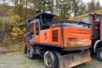 Baggerprozessor Hitachi ZX210W mit Winde und Woody 60