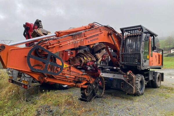 Baggerprozessor Hitachi ZX210W mit Winde und Woody 60