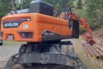 Mobilbagger Develon DX 210W-7 mit WOODY WH6-1 Z